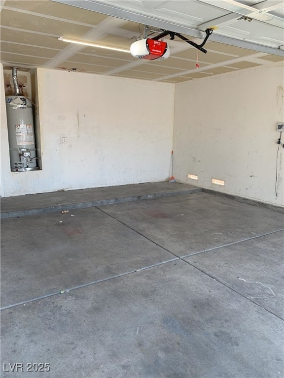 6470 Shining Sand Ave, Las Vegas, NV 89142 - garage with gas water heater and a garage door opener