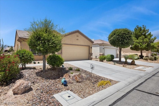 7817 Homing Pigeon St, North Las Vegas, NV 89084 - view of front of home with stucco siding, concrete driveway, and an attached garage