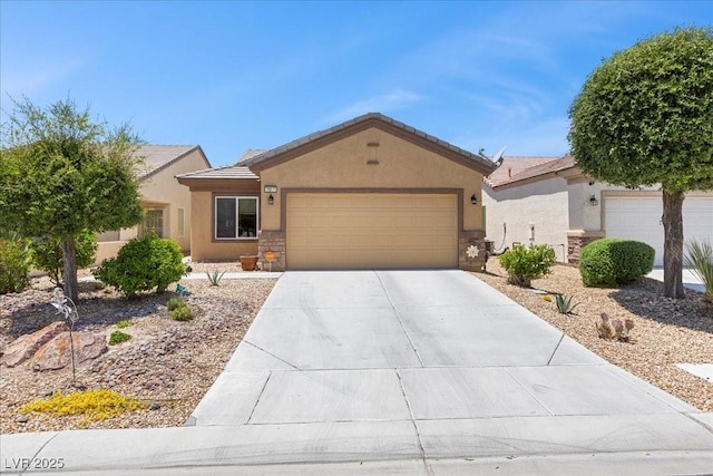 7817 Homing Pigeon St, North Las Vegas, NV 89084 - single story home featuring a garage, stucco siding, driveway, stone siding, and a tile roof