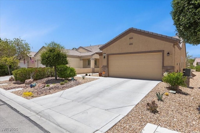 7817 Homing Pigeon St, North Las Vegas, NV 89084 - single story home featuring an attached garage, stucco siding, driveway, and stone siding