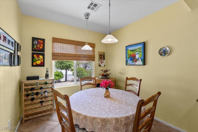7817 Homing Pigeon St, North Las Vegas, NV 89084 - dining area with baseboards and tile patterned flooring