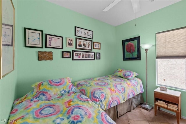7817 Homing Pigeon St, North Las Vegas, NV 89084 - tiled bedroom with a ceiling fan