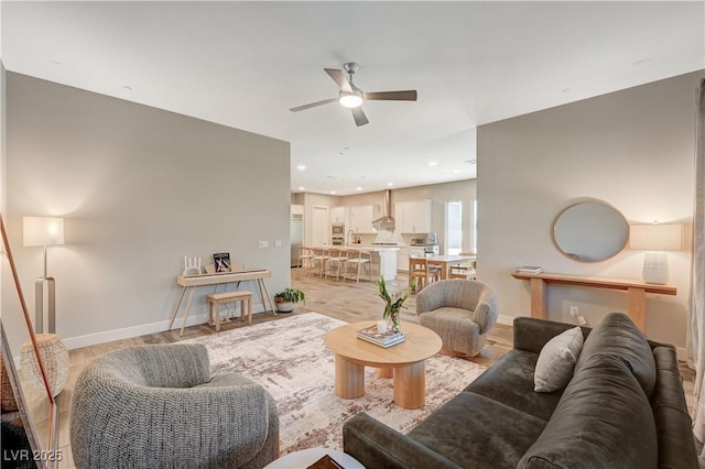 7736 Tioga Ridge Ct, Las Vegas, NV 89117 - living area featuring a ceiling fan and light wood-style flooring