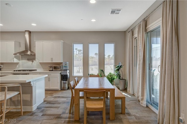 7736 Tioga Ridge Ct, Las Vegas, NV 89117 - dining space with light wood finished floors and recessed lighting