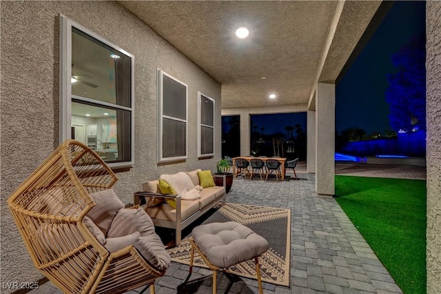 7736 Tioga Ridge Ct, Las Vegas, NV 89117 - patio at twilight with a patio, an outdoor hangout area, and outdoor dining area