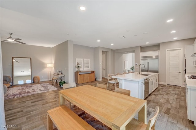 7736 Tioga Ridge Ct, Las Vegas, NV 89117 - dining room featuring ceiling fan, light wood-style flooring, and recessed lighting