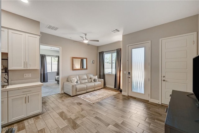 7736 Tioga Ridge Ct, Las Vegas, NV 89117 - living area featuring ceiling fan and light wood-style flooring
