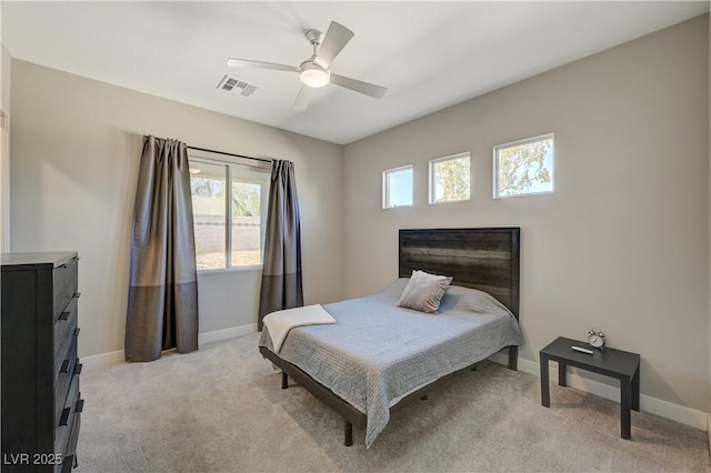 7736 Tioga Ridge Ct, Las Vegas, NV 89117 - bedroom with multiple windows, light colored carpet, and a ceiling fan