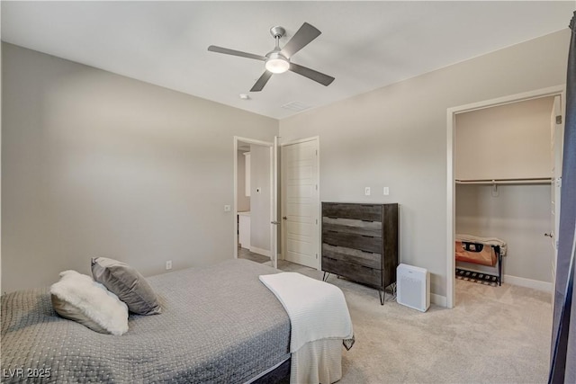 7736 Tioga Ridge Ct, Las Vegas, NV 89117 - bedroom featuring light colored carpet, ceiling fan, a spacious closet, and a closet