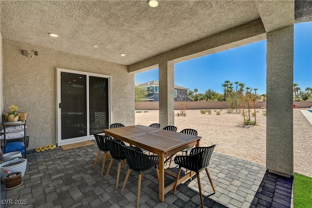 7736 Tioga Ridge Ct, Las Vegas, NV 89117 - fenced backyard with a patio and outdoor dining space