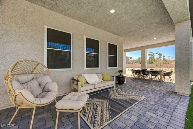 7736 Tioga Ridge Ct, Las Vegas, NV 89117 - view of patio featuring outdoor dining space and outdoor lounge area