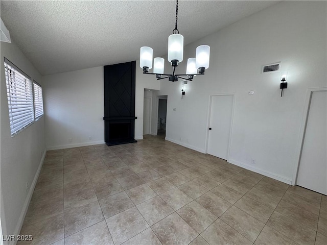 2318 El Molino Cir, Las Vegas, NV 89108 - unfurnished dining area featuring a chandelier, a textured ceiling, lofted ceiling, and light tile patterned flooring