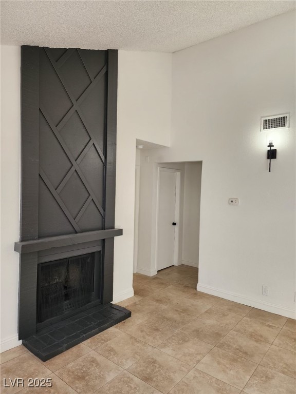 2318 El Molino Cir, Las Vegas, NV 89108 - unfurnished living room with a textured ceiling and a towering ceiling