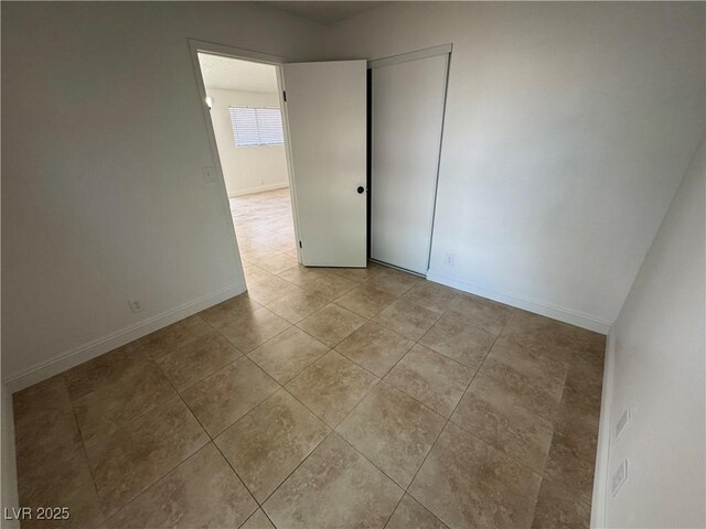 2318 El Molino Cir, Las Vegas, NV 89108 - empty room with light tile patterned floors and baseboards