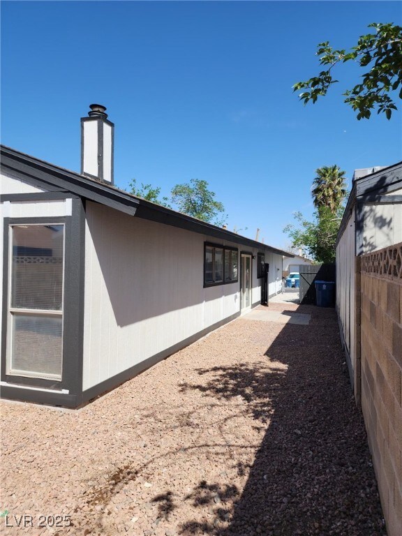 2318 El Molino Cir, Las Vegas, NV 89108 - view of side of property featuring a chimney