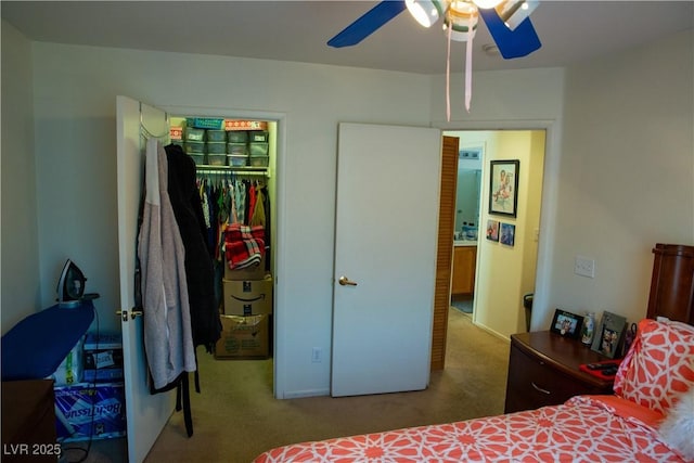 5216 Loma Verde Ave, Las Vegas, NV 89108 - carpeted bedroom with a closet, a walk in closet, and a ceiling fan