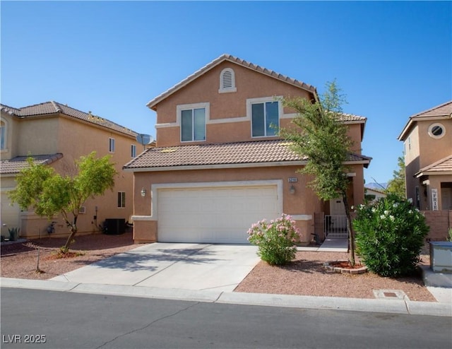 5216 Loma Verde Ave, Las Vegas, NV 89108 - view of front of house featuring stucco siding, a tile roof, a garage, and concrete driveway