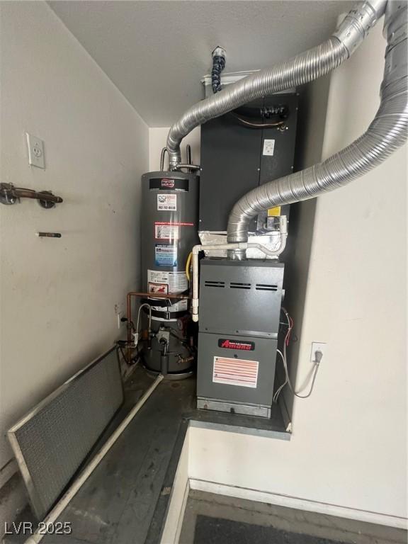 2925 Big Green Ln, Las Vegas, NV 89134 - utility room with strapped water heater and heating unit