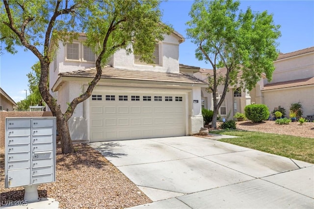 981 Leadville Meadows Dr, Henderson, NV 89052 - view of front of house with stucco siding, an attached garage, concrete driveway, and a tile roof