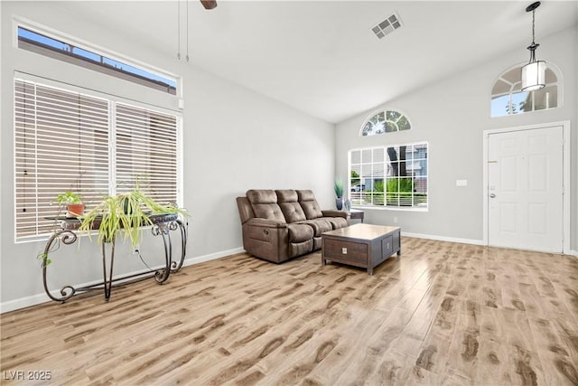 981 Leadville Meadows Dr, Henderson, NV 89052 - living area with light wood-type flooring, a ceiling fan, and high vaulted ceiling