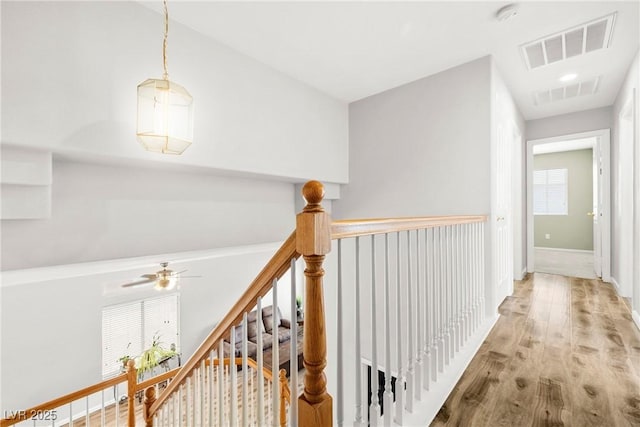 981 Leadville Meadows Dr, Henderson, NV 89052 - hallway featuring an upstairs landing and wood finished floors