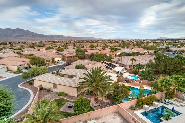 8633 Kennedy Heights Ct, Las Vegas, NV 89131 - aerial perspective of suburban area featuring a pool and a mountainous background