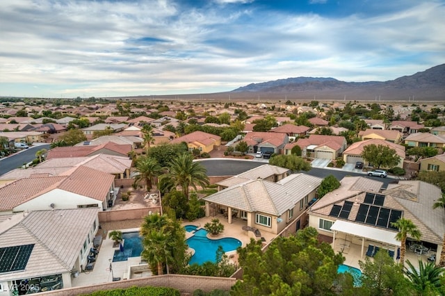 8633 Kennedy Heights Ct, Las Vegas, NV 89131 - aerial perspective of suburban area with a pool area and mountains