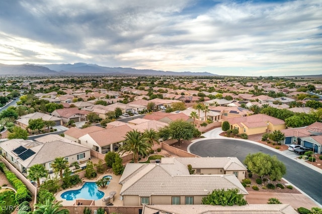 8633 Kennedy Heights Ct, Las Vegas, NV 89131 - aerial perspective of suburban area with a pool and a mountain backdrop