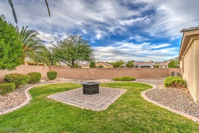 8633 Kennedy Heights Ct, Las Vegas, NV 89131 - fenced backyard with an outdoor fire pit and a patio area