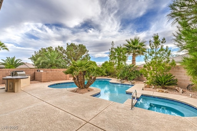 8633 Kennedy Heights Ct, Las Vegas, NV 89131 - view of swimming pool with an outdoor kitchen, a patio area, and a fenced backyard