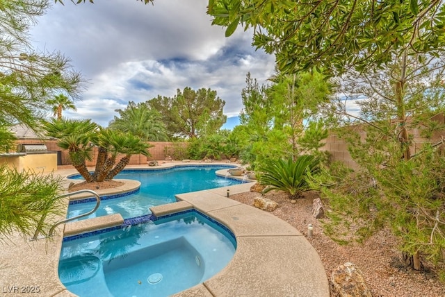 8633 Kennedy Heights Ct, Las Vegas, NV 89131 - view of swimming pool featuring a fenced backyard and a pool with connected hot tub