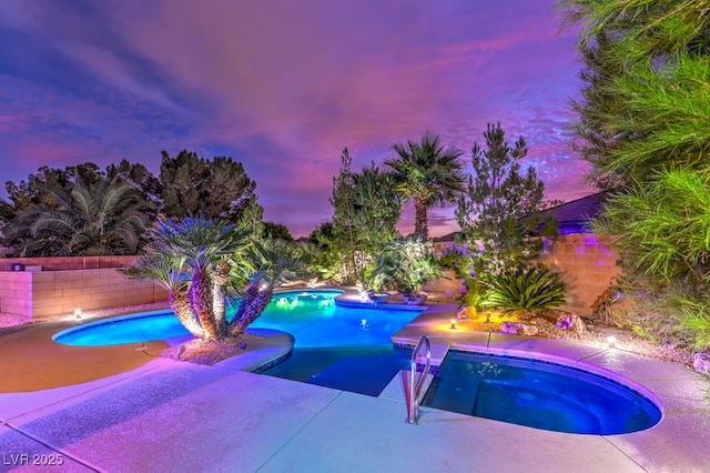 8633 Kennedy Heights Ct, Las Vegas, NV 89131 - view of swimming pool with a pool with connected hot tub, a fenced backyard, and a patio