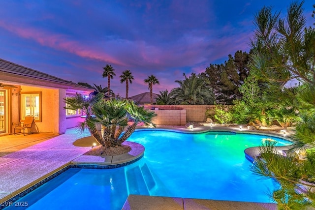 8633 Kennedy Heights Ct, Las Vegas, NV 89131 - pool at dusk featuring a fenced backyard and a patio area