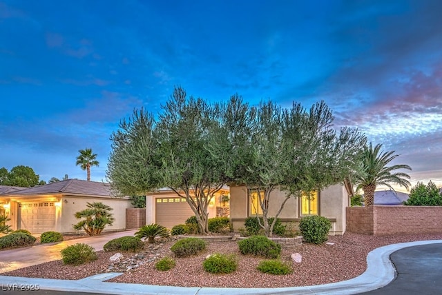 8633 Kennedy Heights Ct, Las Vegas, NV 89131 - view of front of property featuring a garage, stucco siding, and concrete driveway