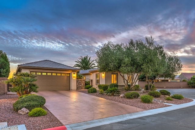 8633 Kennedy Heights Ct, Las Vegas, NV 89131 - view of front of house with stucco siding, concrete driveway, and an attached garage