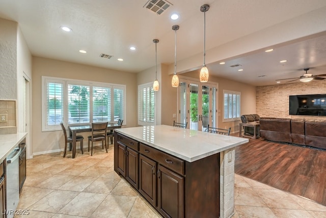 8633 Kennedy Heights Ct, Las Vegas, NV 89131 - kitchen with recessed lighting, light countertops, plenty of natural light, ceiling fan, and dark brown cabinetry