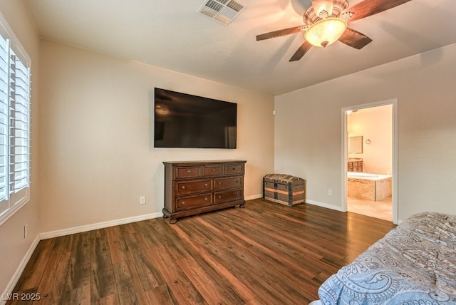 8633 Kennedy Heights Ct, Las Vegas, NV 89131 - bedroom with dark wood finished floors, multiple windows, ensuite bathroom, and ceiling fan