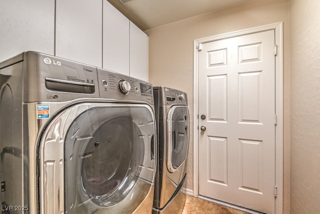 8633 Kennedy Heights Ct, Las Vegas, NV 89131 - laundry room with washer and dryer, cabinet space, tile patterned flooring, and a textured wall