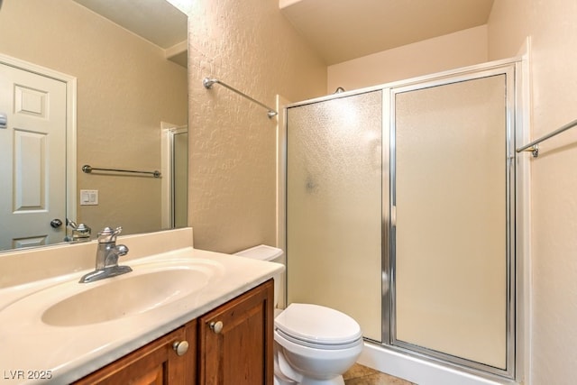 8633 Kennedy Heights Ct, Las Vegas, NV 89131 - full bathroom featuring a shower stall, a textured wall, vanity, and tile patterned flooring