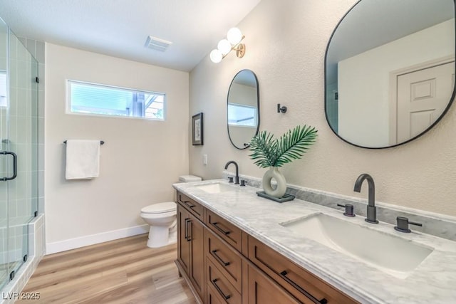 10205 Birch Bluff Ln, Las Vegas, NV 89145 - full bath with a shower stall, double vanity, and wood finished floors