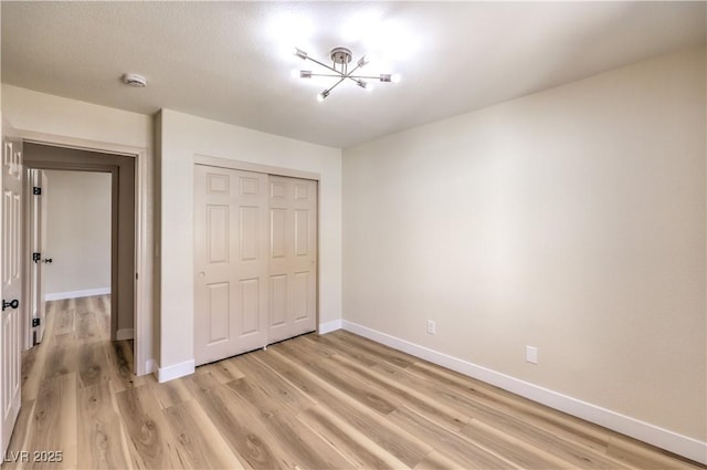 10205 Birch Bluff Ln, Las Vegas, NV 89145 - unfurnished bedroom with light wood finished floors and a closet