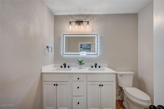 700 Cactus Ln, Las Vegas, NV 89107 - bathroom featuring double vanity and a textured wall