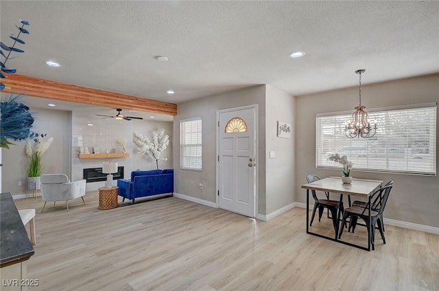 700 Cactus Ln, Las Vegas, NV 89107 - entrance foyer with light wood-type flooring, recessed lighting, a textured ceiling, healthy amount of natural light, and a chandelier