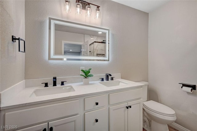 700 Cactus Ln, Las Vegas, NV 89107 - full bath featuring double vanity, a shower, and a textured wall