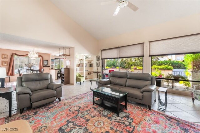 2857 San Lago Ct, Las Vegas, NV 89121 - tiled living area with healthy amount of natural light, a ceiling fan, a chandelier, and high vaulted ceiling