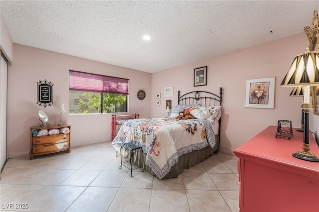 2857 San Lago Ct, Las Vegas, NV 89121 - bedroom featuring a textured ceiling, light tile patterned floors, and recessed lighting