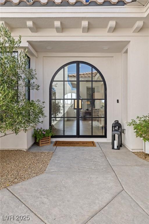 1990 Country Cove Ct, Las Vegas, NV 89135 - doorway to property with stucco siding