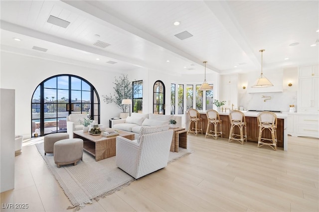 1990 Country Cove Ct, Las Vegas, NV 89135 - living room featuring beam ceiling, plenty of natural light, light wood-style floors, and recessed lighting