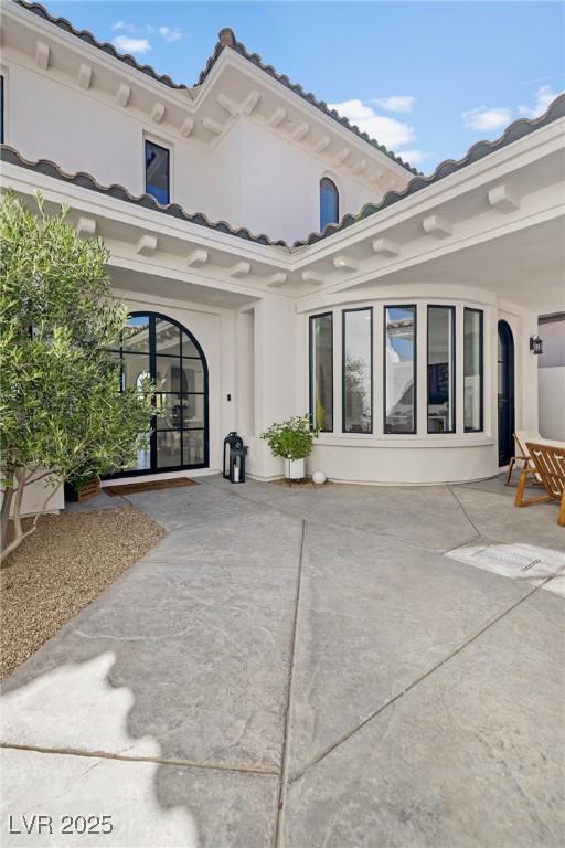 1990 Country Cove Ct, Las Vegas, NV 89135 - rear view of property featuring stucco siding and a tiled roof