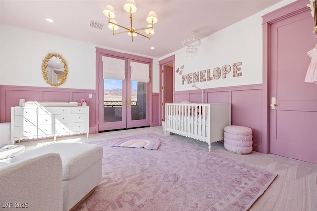 1990 Country Cove Ct, Las Vegas, NV 89135 - bedroom featuring french doors, a decorative wall, a chandelier, carpet floors, and wainscoting